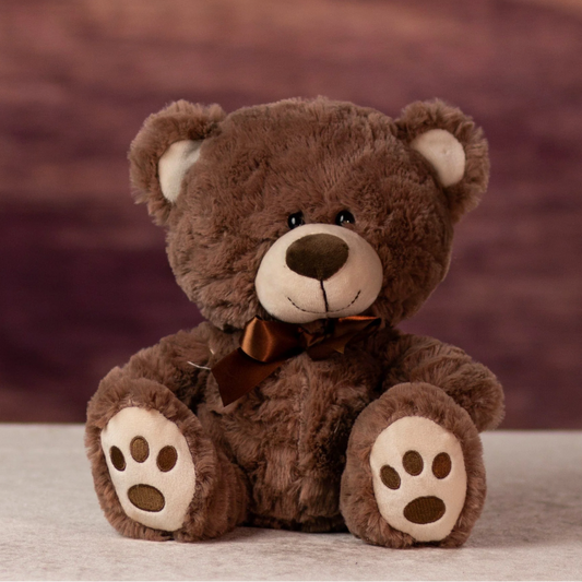 Brown teddy bear with a bow tie