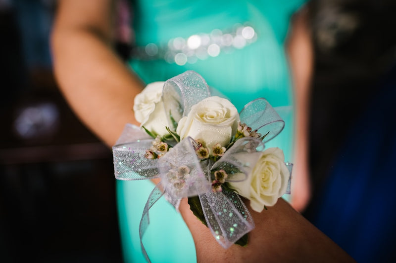 Everything you need to know about that flower that goes on your wrist for prom