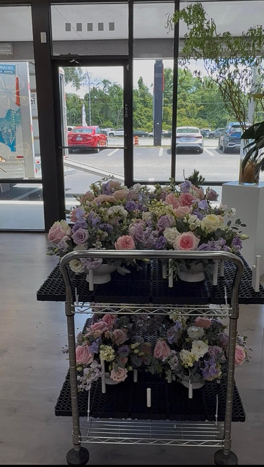 Two carts filled with beautiful floral arrangements in a shop