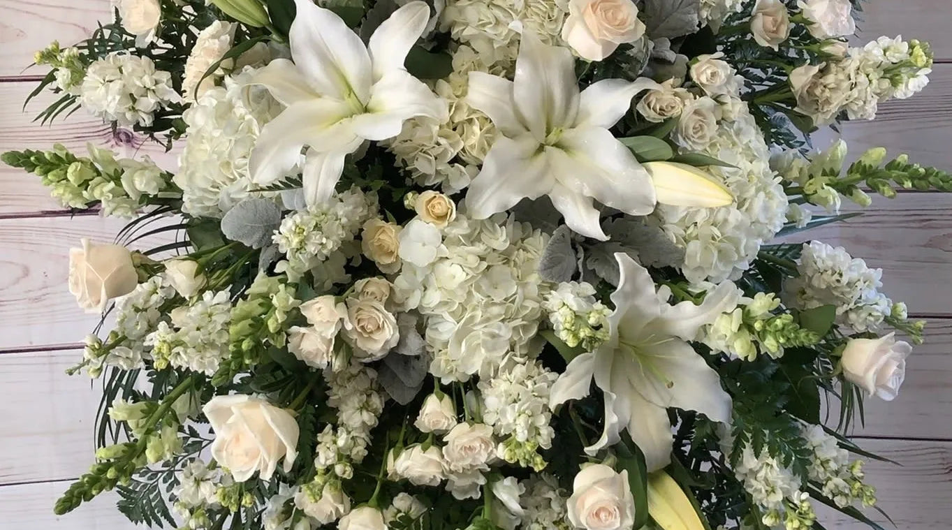White sympathy flower arrangement with lilies and roses – Palm Harbor delivery