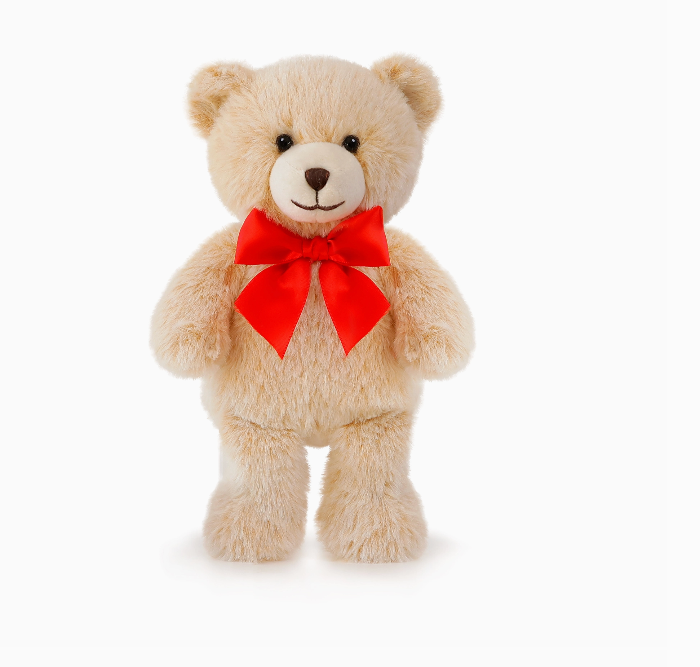 Beige teddy bear with a red bow 