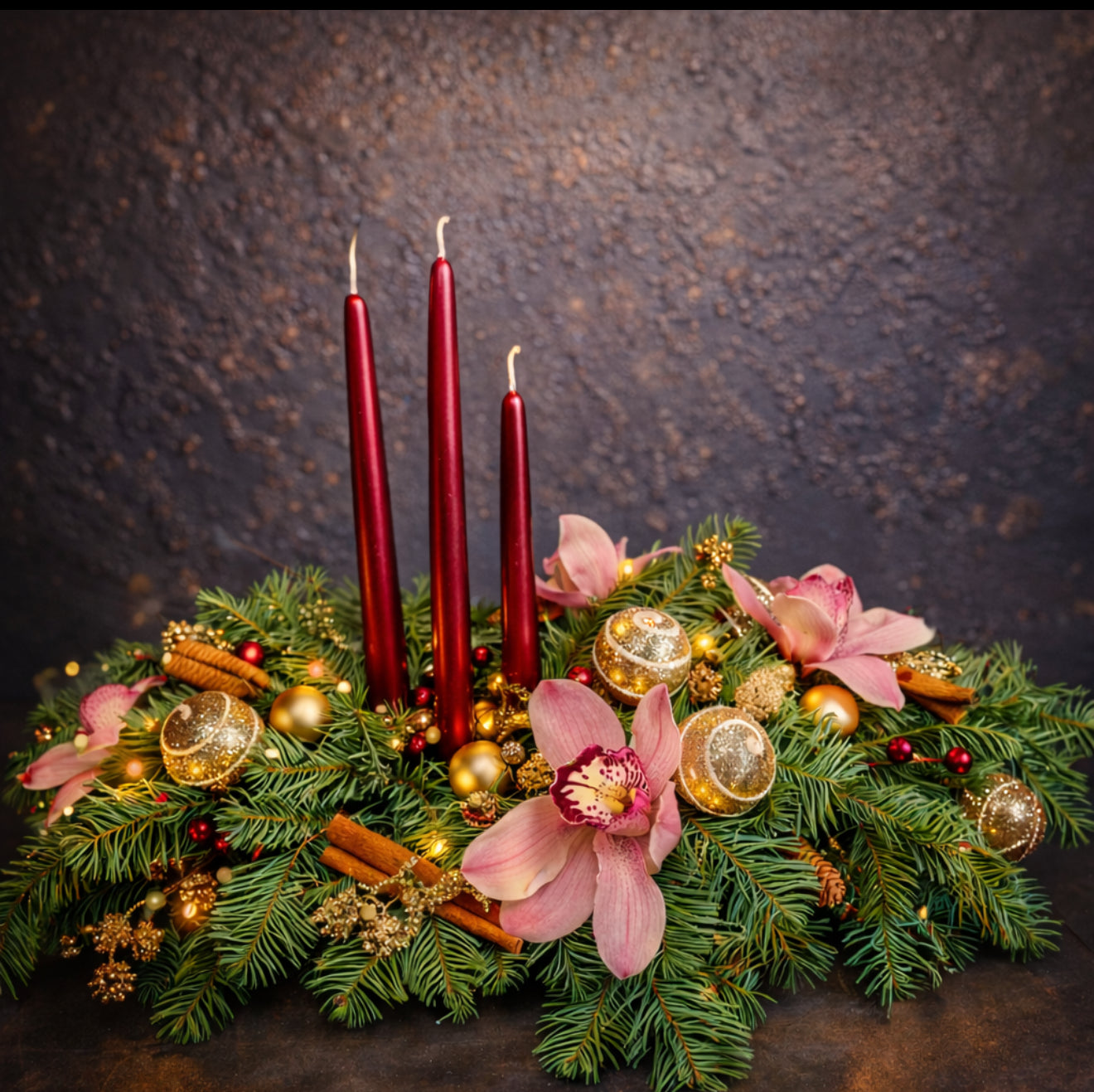 Christmas centerpiece with candles, orchids 