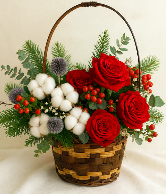 Flower basket with red roses, cotton, christmas greenery 