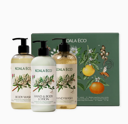 Koala Eco skincare products including body wash, hand & body lotion, and hand wash with a branded box in the background.
