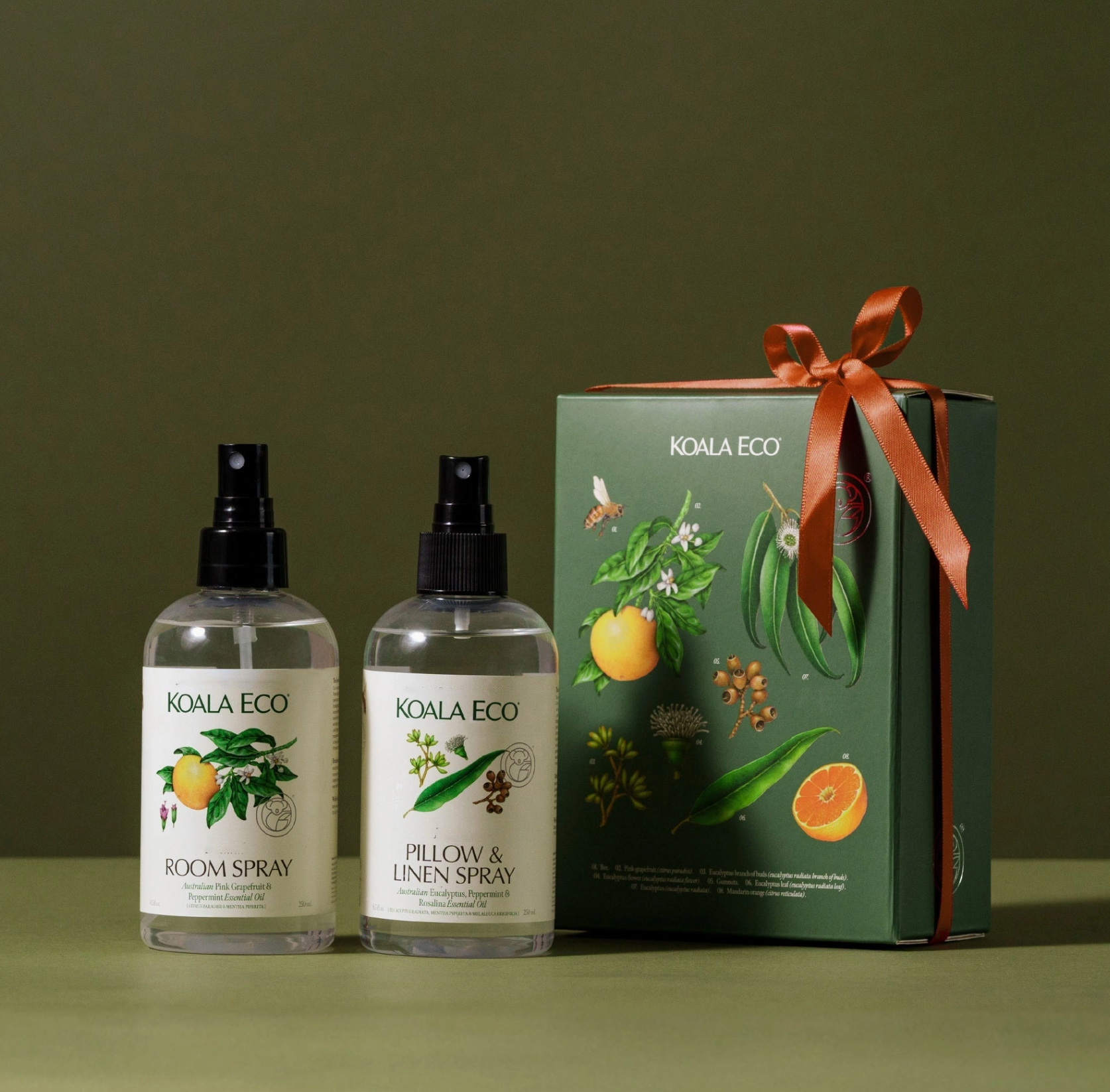 Two Koala Eco room sprays and a gift box on a green background