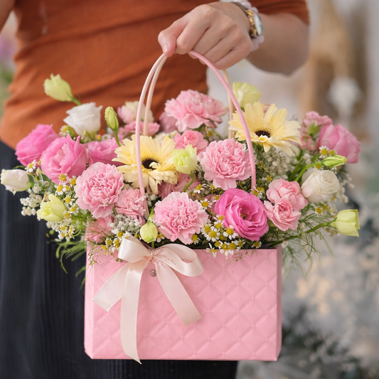 Person holding a pink floral tote 