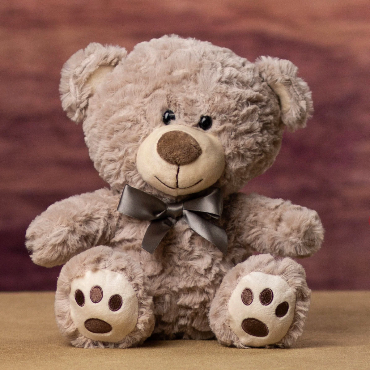 Plush teddy bear with a bow tie 