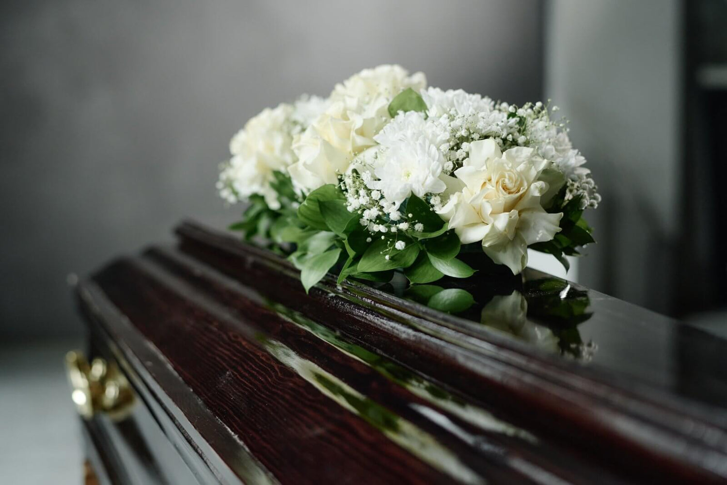 Bouquet of white and green flowers on a piano
