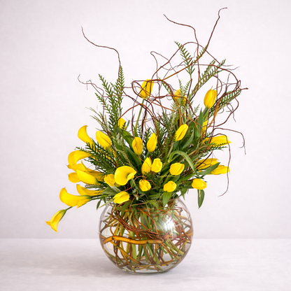 Glass vase with yellow tulips
